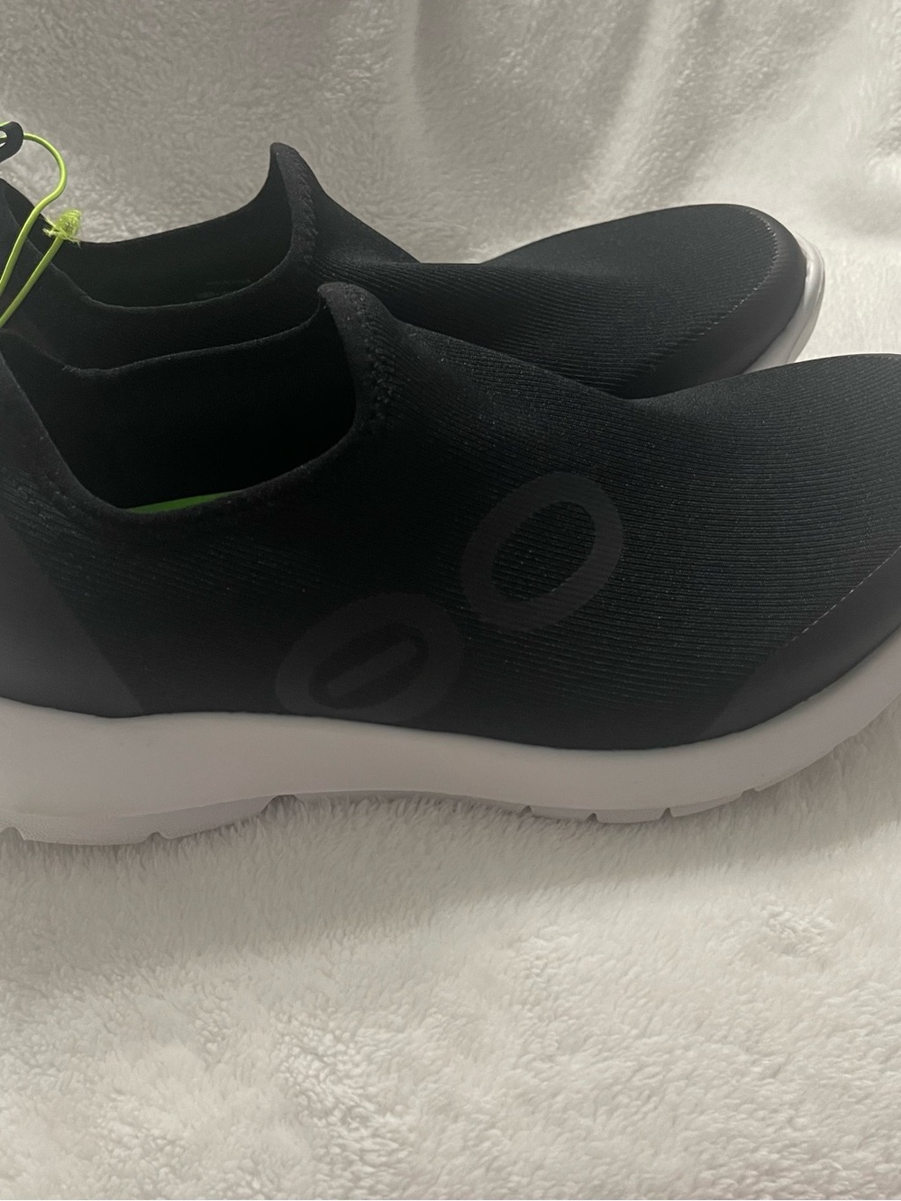 OOFOS Black Slip-On Sneakers with White Sole W9